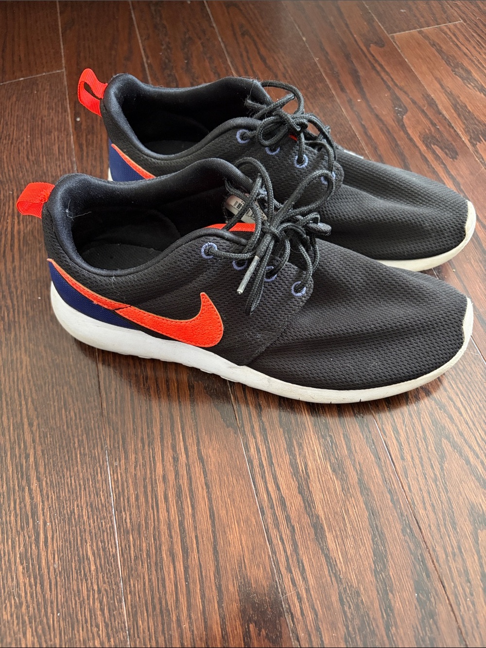 Nike Black Shoes with Orange Swoosh and Blue Heel Tab